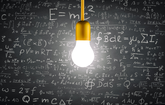 bright light bulb hanging in front of chalkboard with mathmatical equations